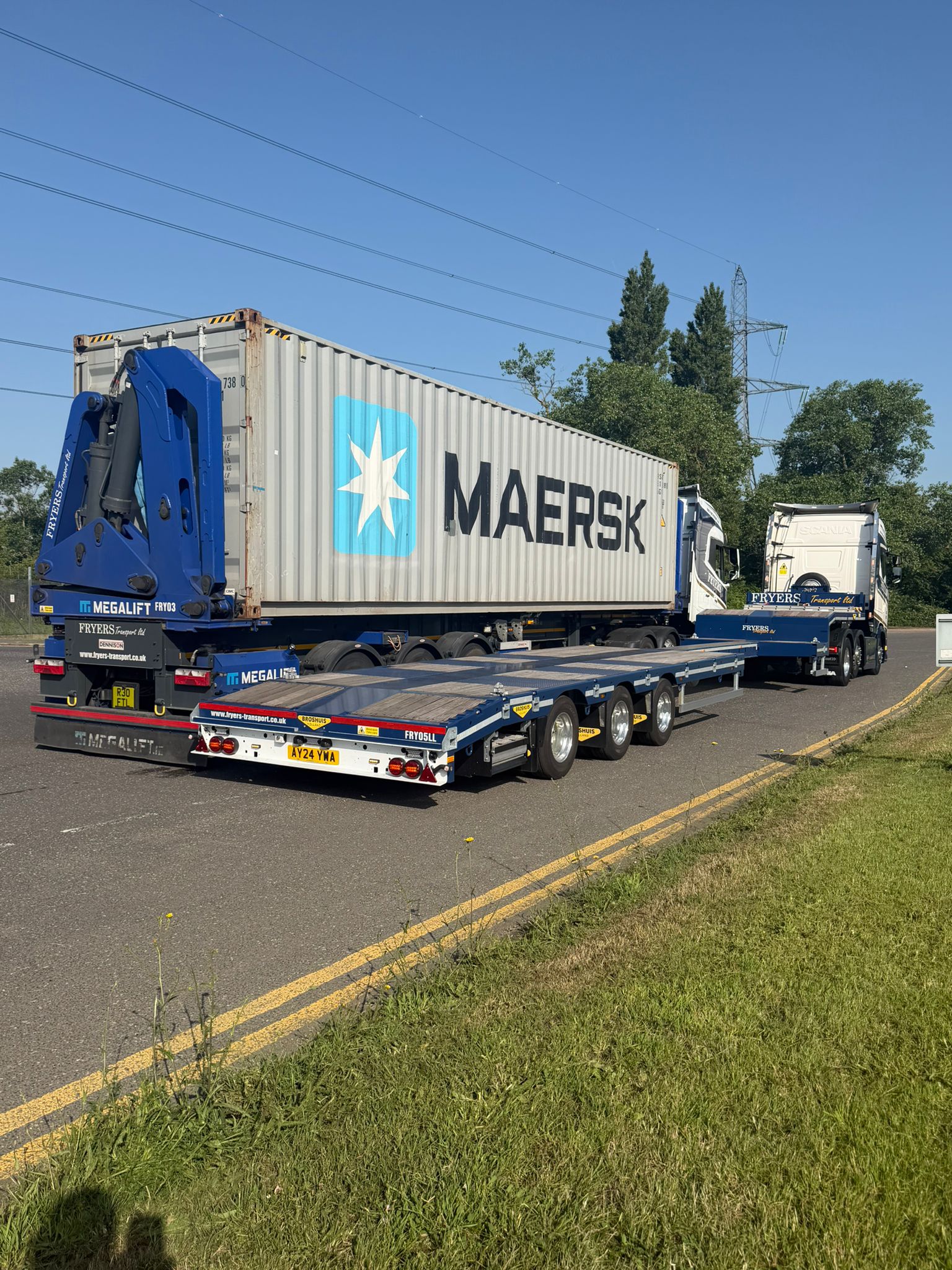 Fryers vehicle beside shipping containers
